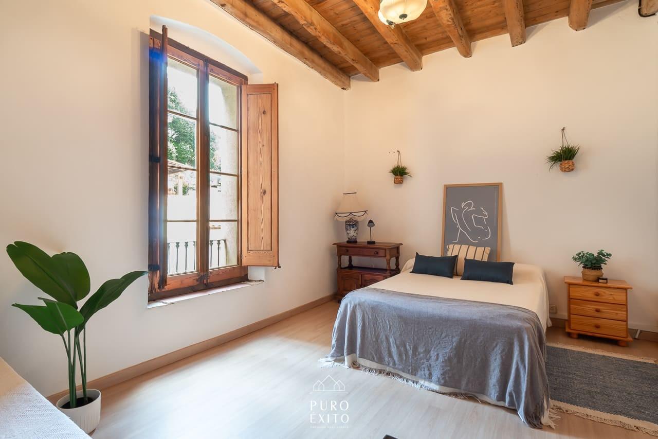 Bedroom with shuttered window
