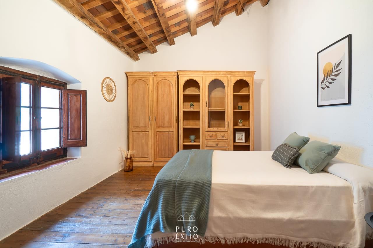 Bedroom with pine wardrobe and old floorboards