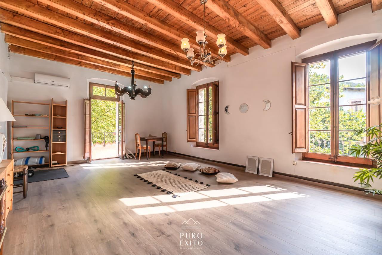 Living room with beamed ceiling