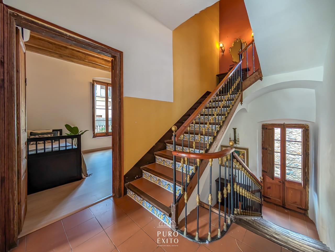 Tiled staircase with brass balusters